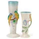 Clarice Cliff, two Art Deco cylindrical and tapering vases including one decorated in relief with