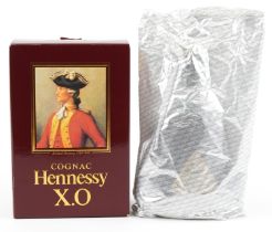 Bottle of Hennessey XO cognac with box housed in a sealed bag