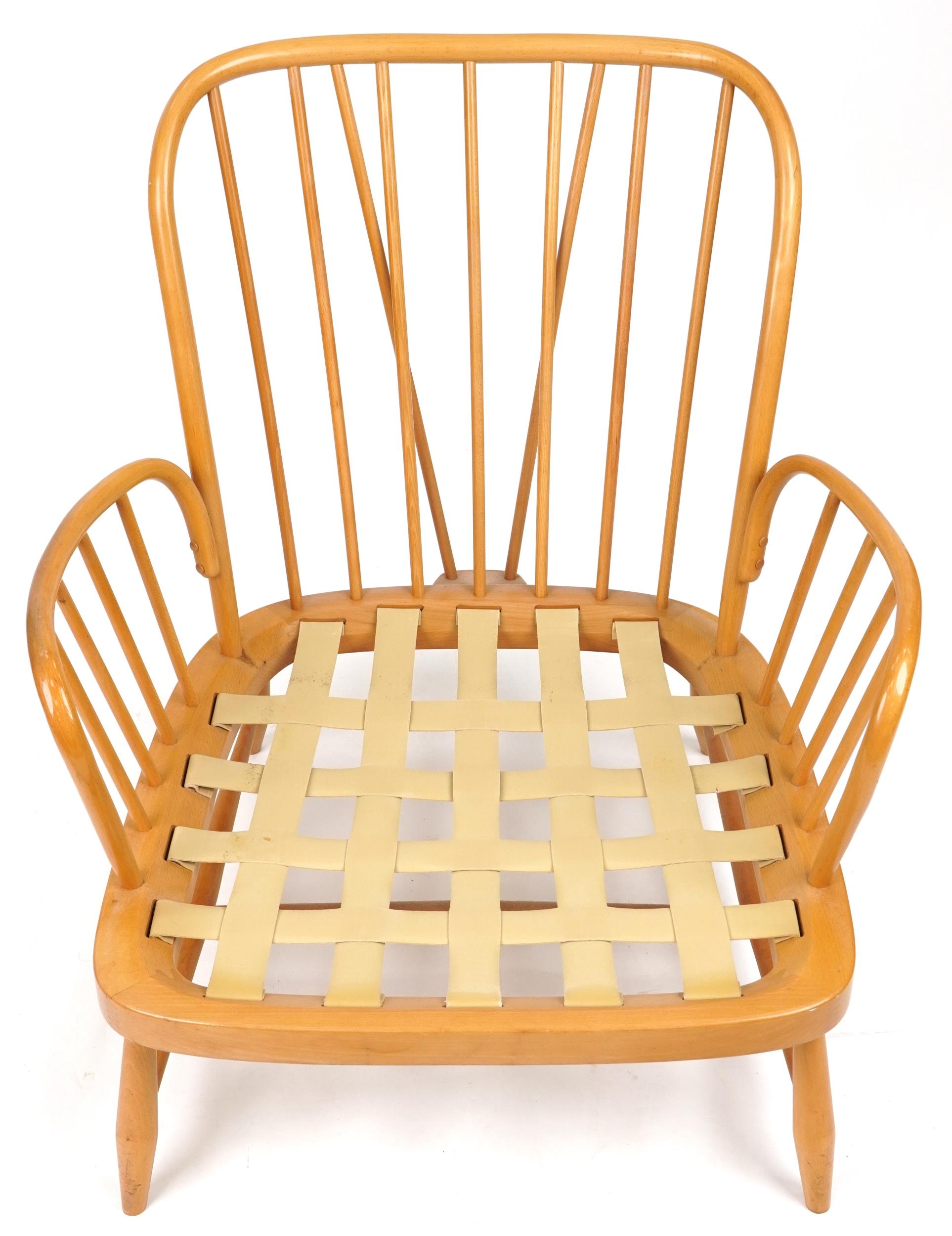Ercol light elm Jubilee stick back armchair with red fleur de lis upholstered cushioned seats, - Image 3 of 6