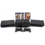 Sony PlayStation 3 games console with two controllers and two Sony PlayStation 2 games consoles with