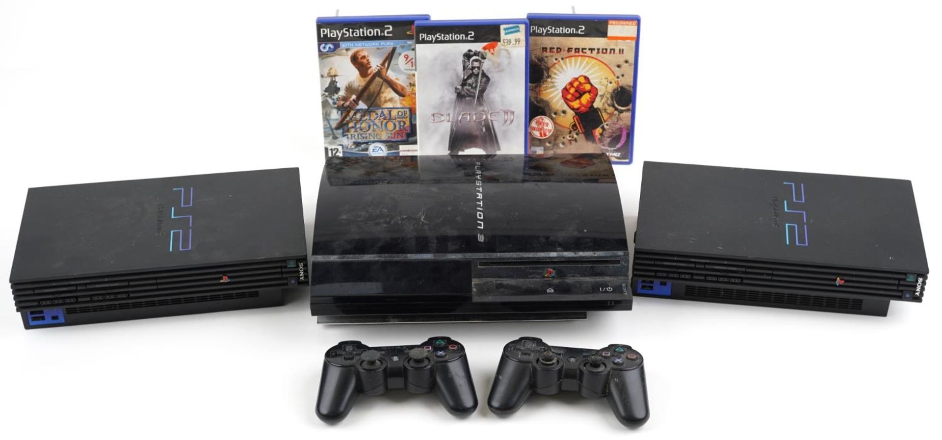 Sony PlayStation 3 games console with two controllers and two Sony PlayStation 2 games consoles with