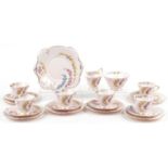 Tuscan six place tea service decorated with flowers comprising six trios, milk jug, sugar bowl and