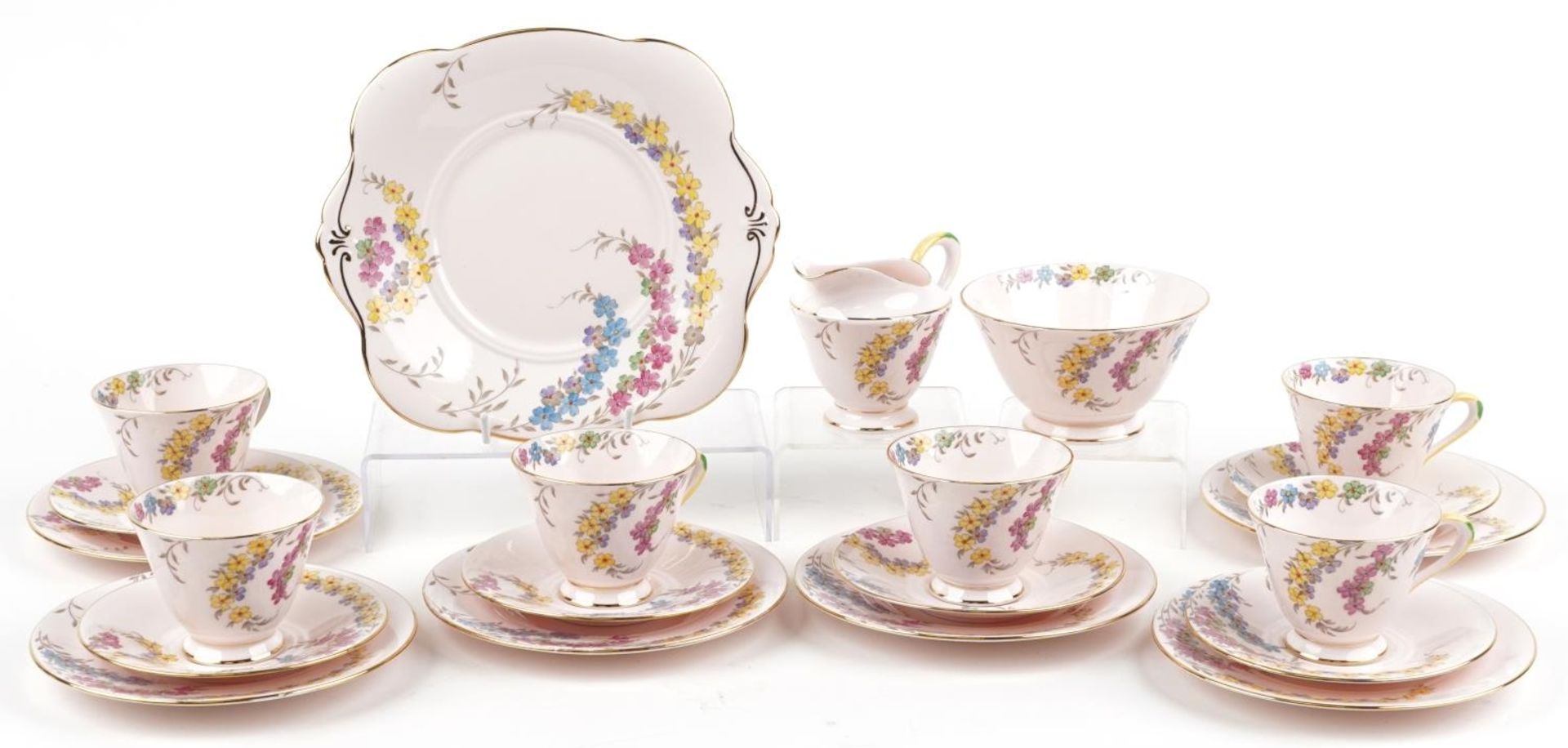 Tuscan six place tea service decorated with flowers comprising six trios, milk jug, sugar bowl and