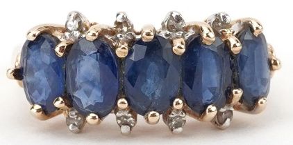 14K gold sapphire and diamond ring set with five sapphires and eight diamonds, each sapphire