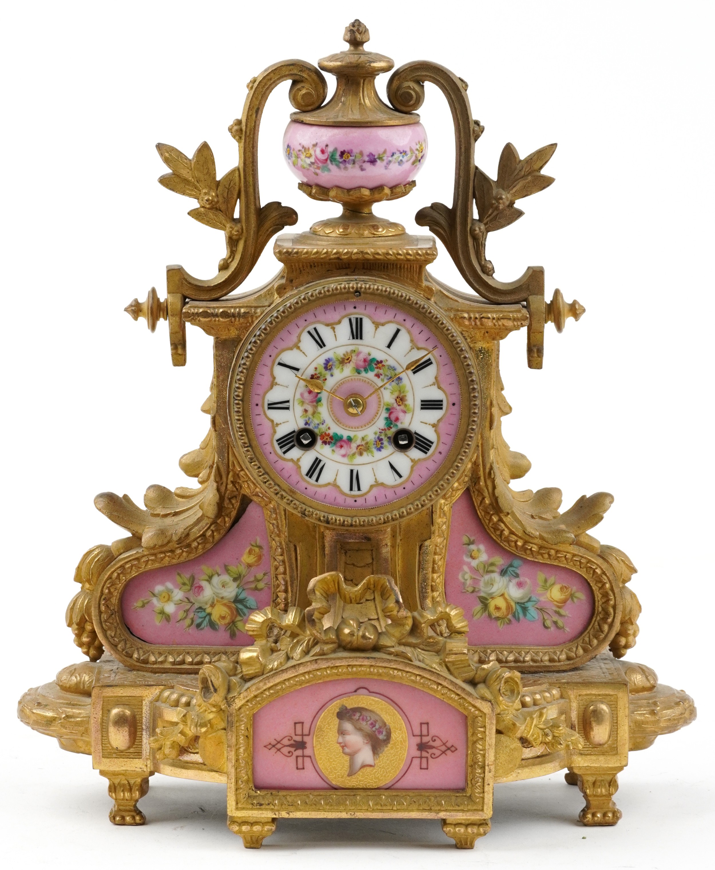 19th century French ormolu mantle clock striking on a bell having urn finial and Sevres type