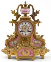 19th century French ormolu mantle clock striking on a bell having urn finial and Sevres type