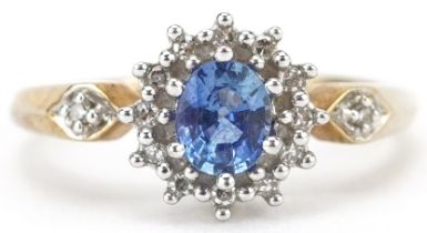 9ct gold sapphire and diamond cluster ring with diamond set shoulders, the sapphire approximately