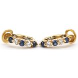 Pair of 18ct gold diamond and sapphire half hoop earrings, the largest diamonds each approximately