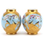 Limoges, pair of French blue ground porcelain vases hand painted and gilded with stylised birds