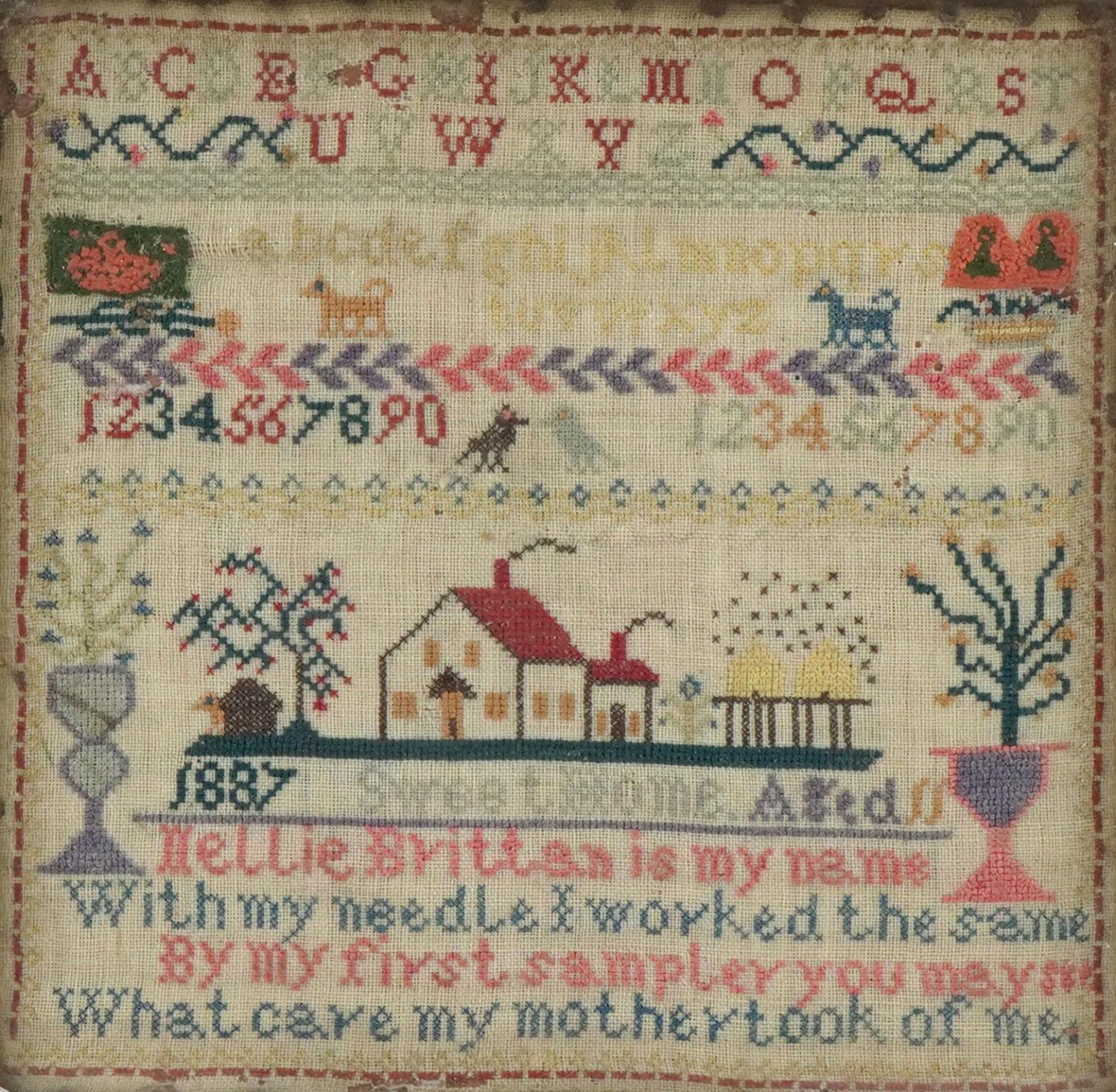 Victorian needlework sampler worked by Nellie Brittan aged eleven, dated 1887, framed and glazed,