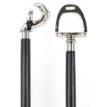 Two ebonised walking sticks with chromed handles, one in the form of a hand holding a crystal