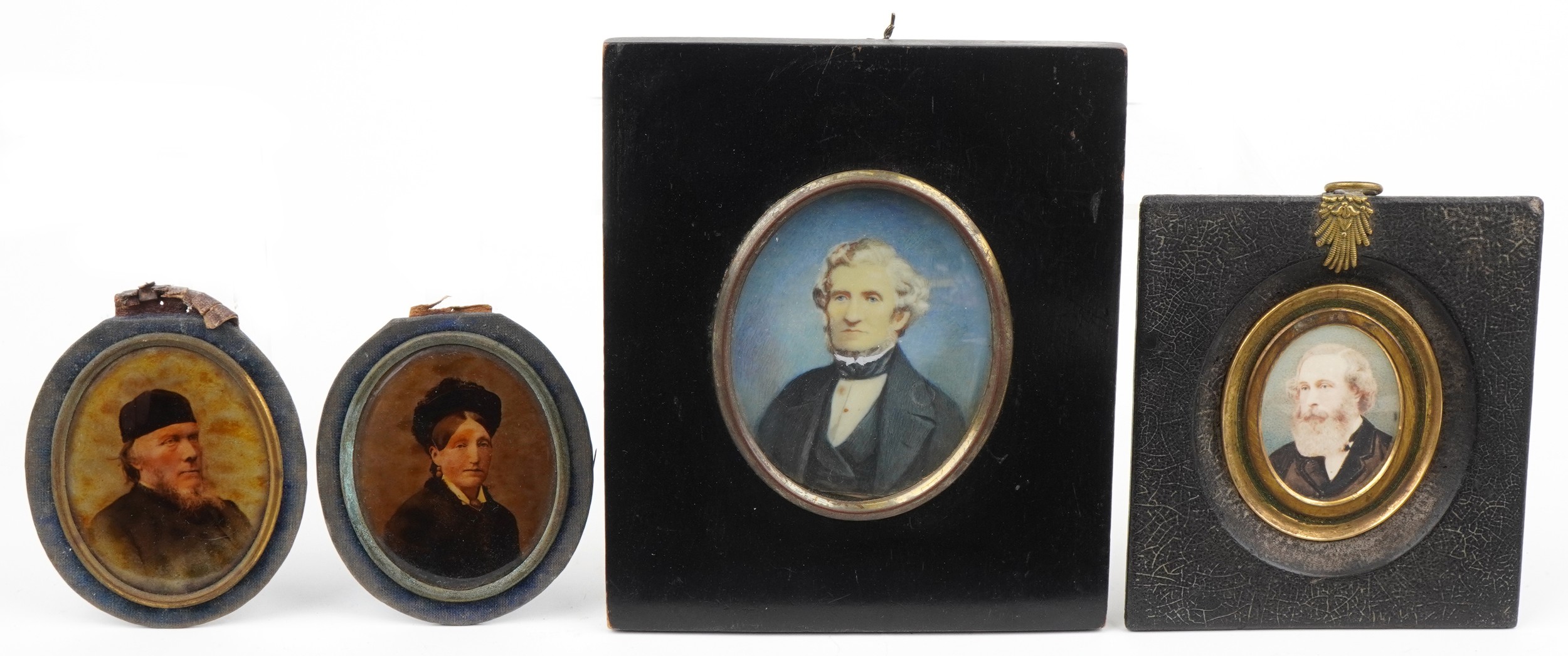 Four hand painted portrait miniatures and photographs, two housed in ebonised frames, including an