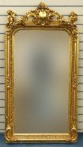 Large ornate gilt framed mirror having bevelled glass mounted with Putti musicians and swags, 62cm x