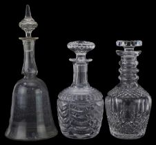 Three cut glass decanters including one with swags, the largest 33.5cm high