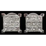 Pair of unmarked white gold princess cut diamond cluster stud earrings with certificate, total