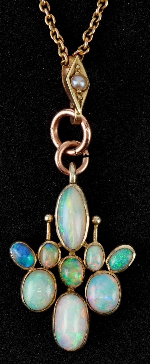 Unmarked gold cabochon opal cluster pendant on a 9ct gold necklace, 4.5cm high and 40cm in length,