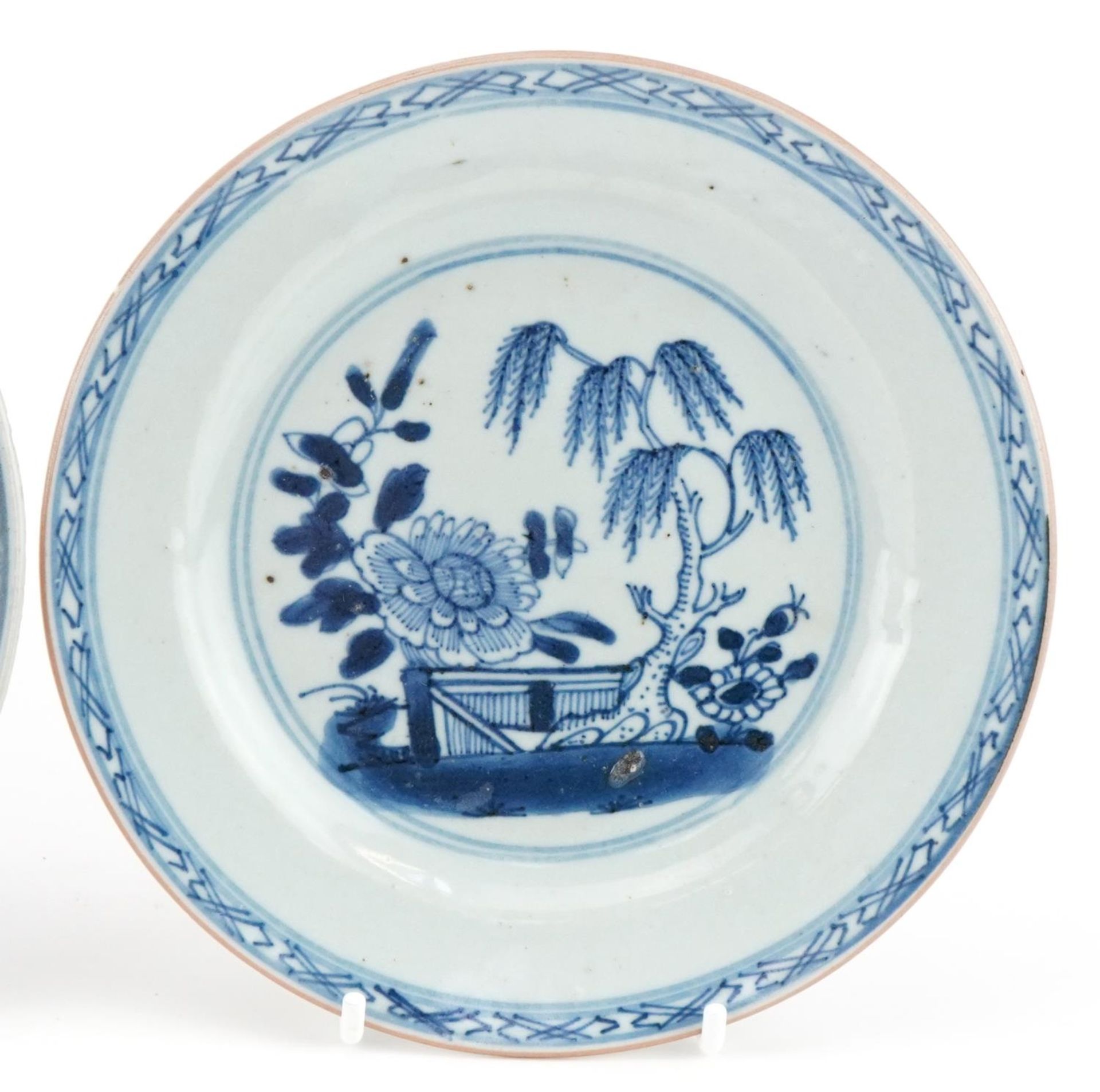 Three 18th century hand painted blue and white plates, two in the Willow pattern, one with - Image 3 of 4