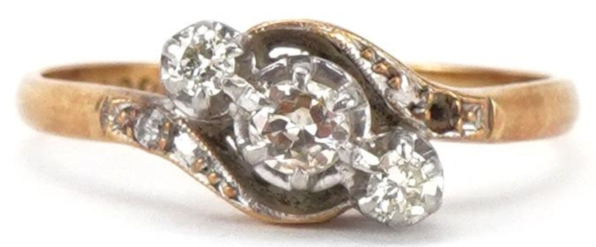 18ct gold and platinum diamond three stone crossover ring with diamond set shoulders, total