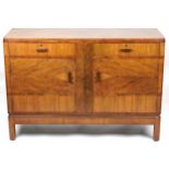 Art Deco walnut sideboard with two drawers above a pair of cupboard doors enclosing shelves, 95cm