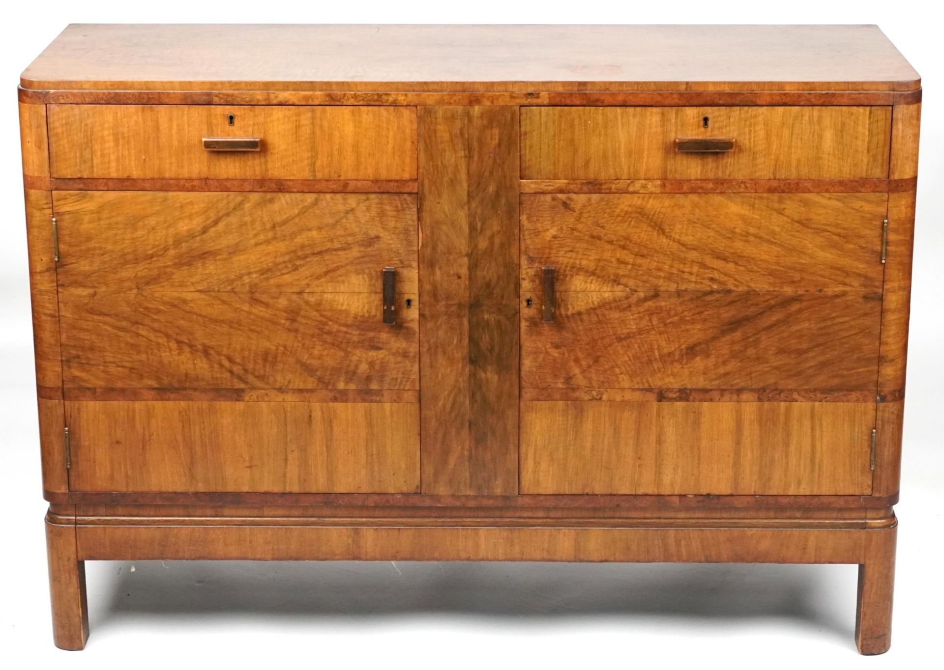 Art Deco walnut sideboard with two drawers above a pair of cupboard doors enclosing shelves, 95cm