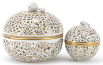 Herend, two Hungarian hand painted porcelain openwork bonbonnieres with strawberry knops, the