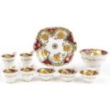 Victorian teaware hand painted and gilded with flowers, seven cups, slop bowl and side plate, the