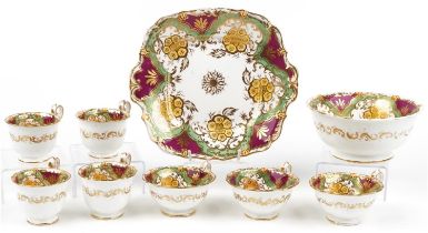 Victorian teaware hand painted and gilded with flowers, seven cups, slop bowl and side plate, the