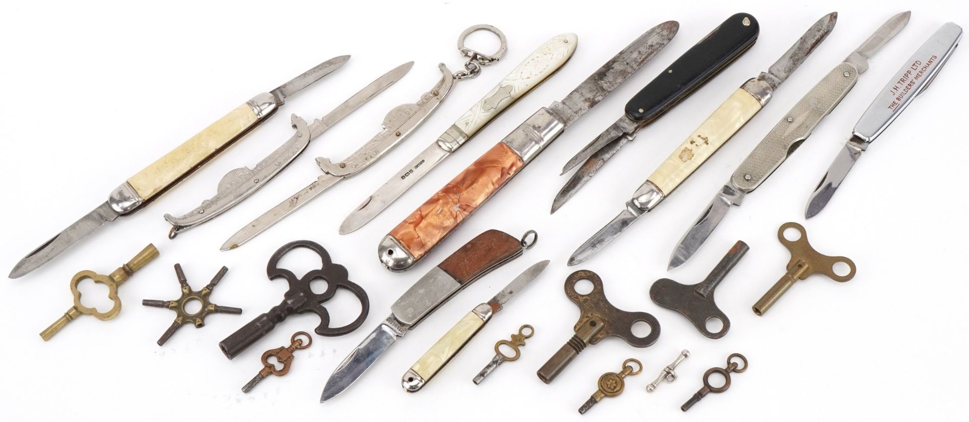 Folding pocket knives and various watch keys including mother of pearl flanked folding fruit knife