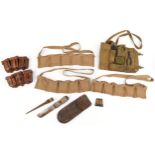 Military interest World War II leather and canvas bullet belts together with a canvas tool kit