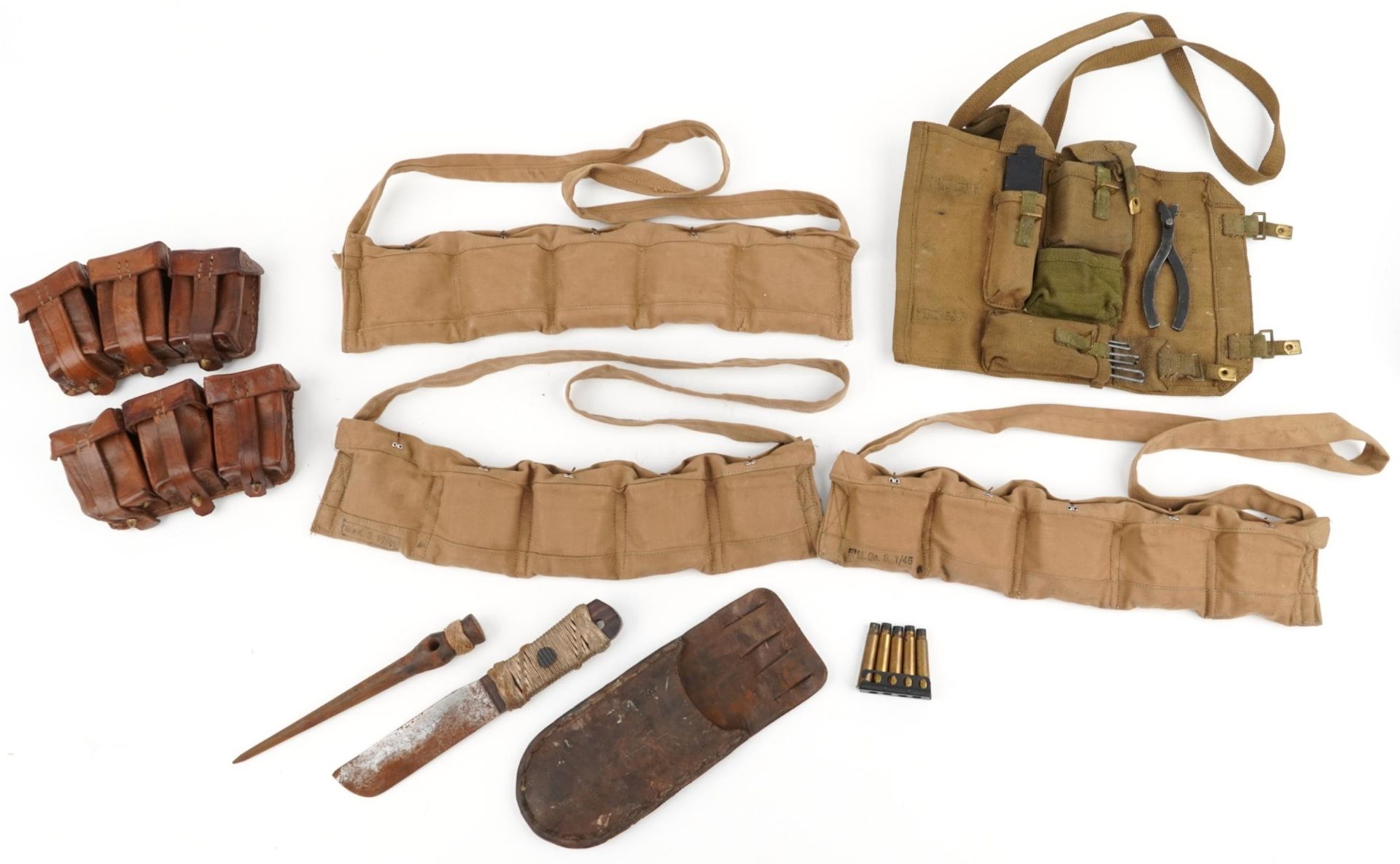Military interest World War II leather and canvas bullet belts together with a canvas tool kit