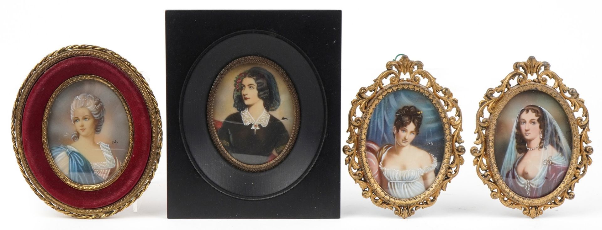 Four oval hand painted and hand coloured oval portrait miniatures including a pair housed in gilt