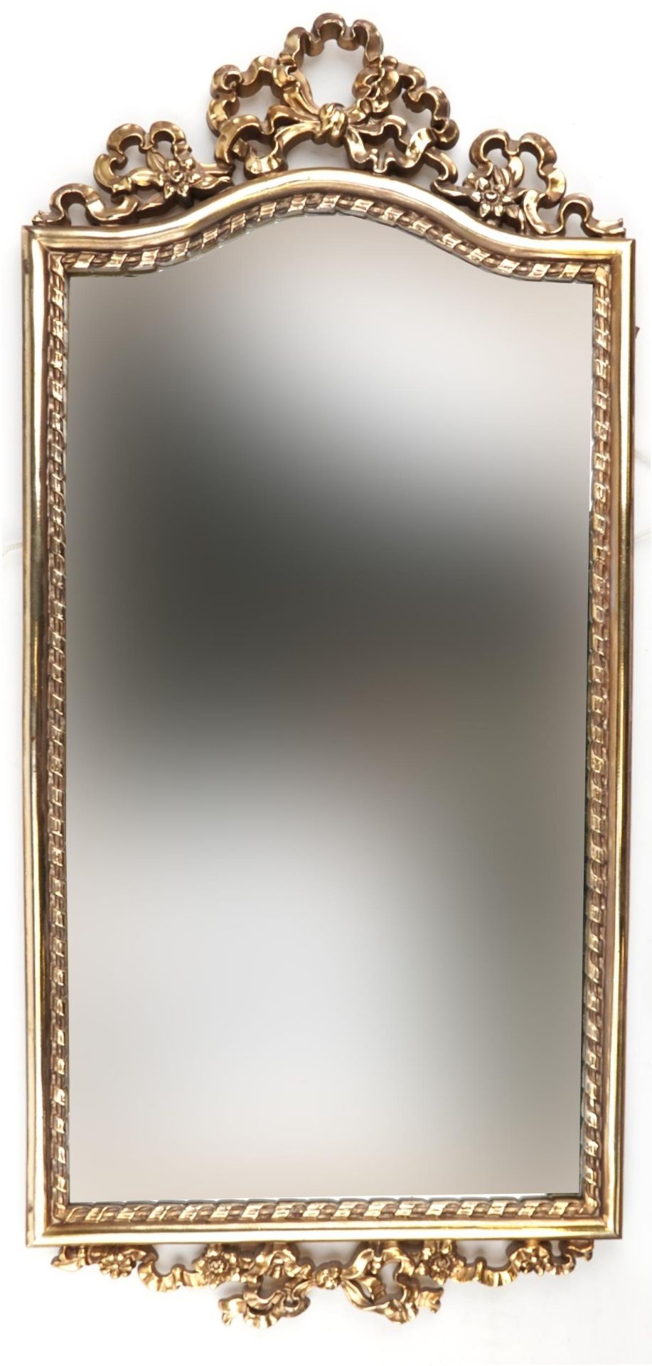 Ornate gilt framed pier mirror with bow crest, 88cm x 38.5cm