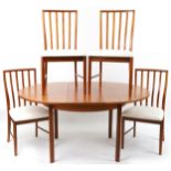 Mackintosh, mid century Scottish teak circular extending dining table with four chairs, the table