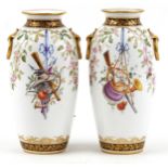 Pair of 19th century European porcelain vases with ring turned handles hand painted with hanging
