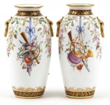 Pair of 19th century European porcelain vases with ring turned handles hand painted with hanging