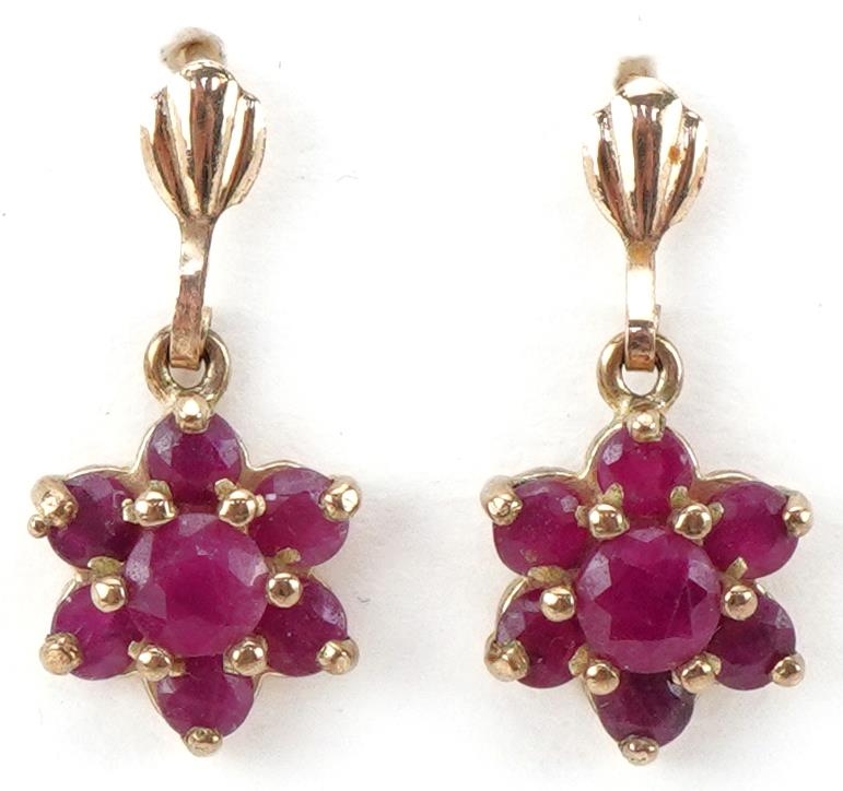 Pair of unmarked gold ruby flower head drop earrings, each 1.7cm high, total 1.4g