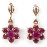 Pair of unmarked gold ruby flower head drop earrings, each 1.7cm high, total 1.4g