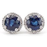 Pair of unmarked gold diamond and sapphire stud earrings, each sapphire approximately 5.50mm in