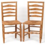 Pair of beech ladderback chairs with cane seats, each 93cm high