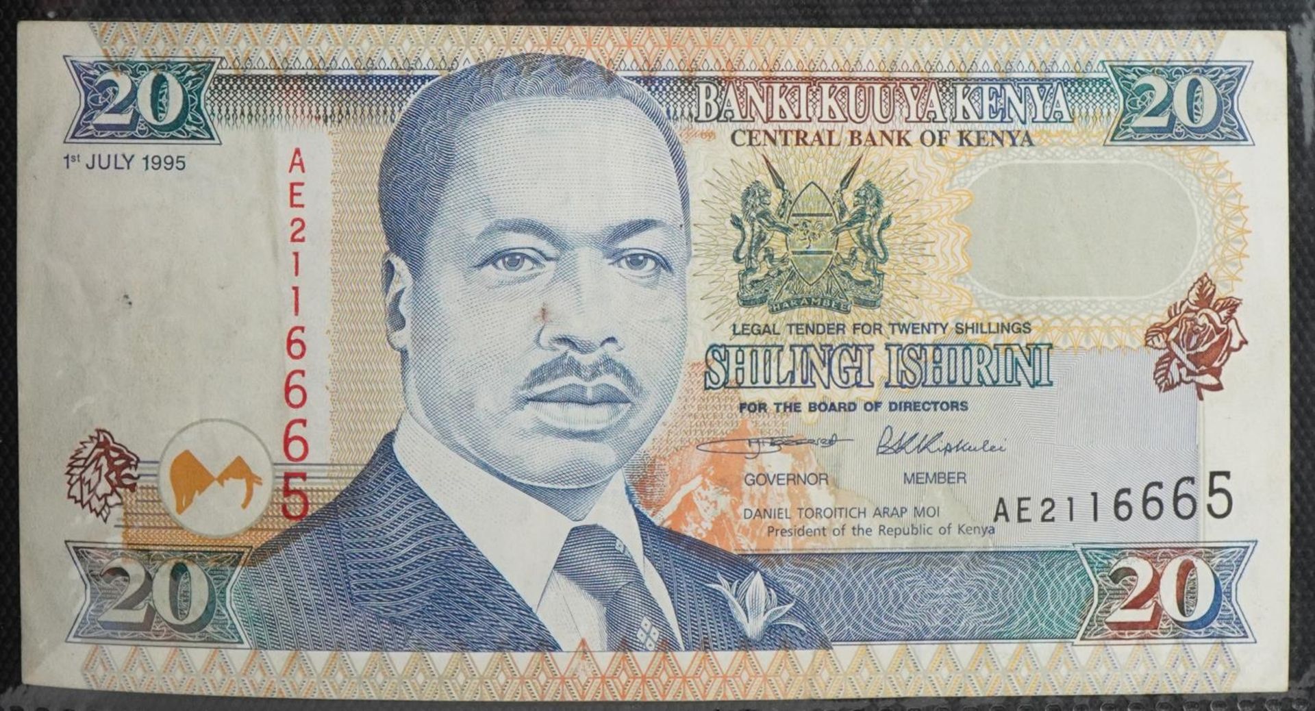 World banknotes arranged in an album including Bank of Scotland twenty pounds, Kenya, Indonesia