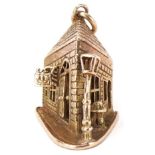 Large 9ct gold charm in the form of a crooked Pub on the Corner, 2.5cm high, 7.0g