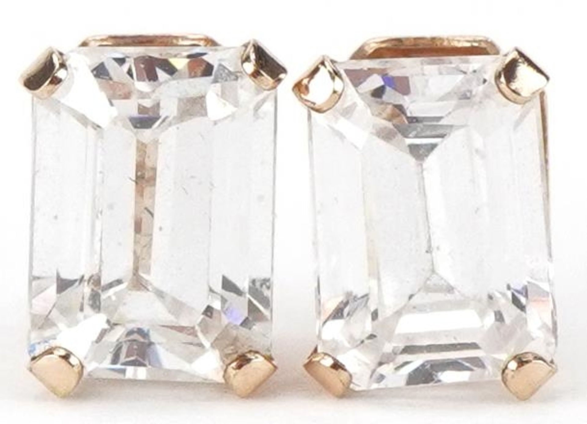 Pair of 9ct gold clear stone stud earrings, each 7mm high, total 1.1g