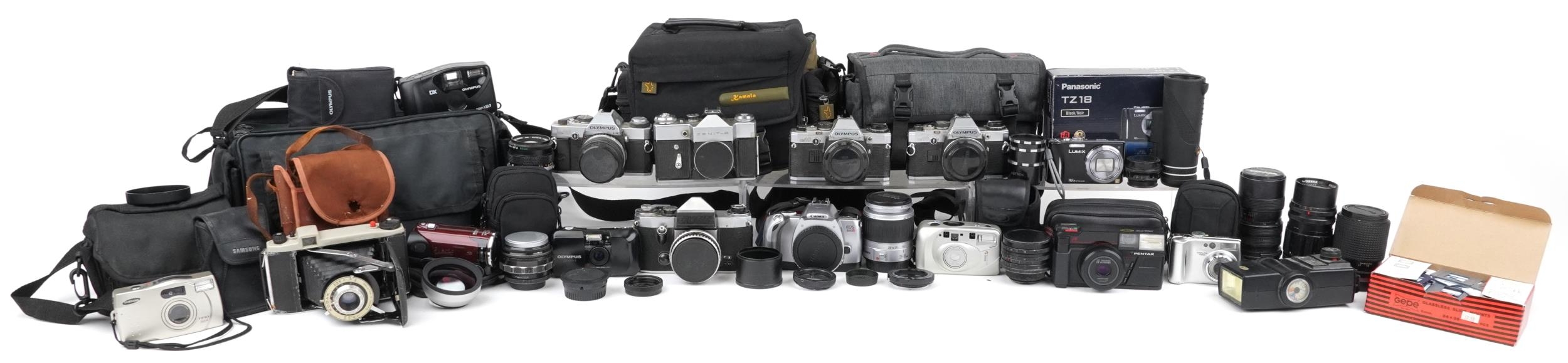 Vintage and later cameras, lenses and accessories including Zenit-B, Canon EOS300V, Olympus,