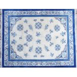 Large Chinese blue and cream ground rug having an allover floral design, 370cm x 275cm