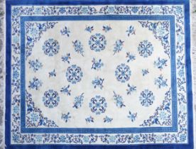 Large Chinese blue and cream ground rug having an allover floral design, 370cm x 275cm