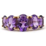 9ct gold graduated amethyst five stone ring, the largest amethyst approximately 8.0mm x 5.80mm x 4.