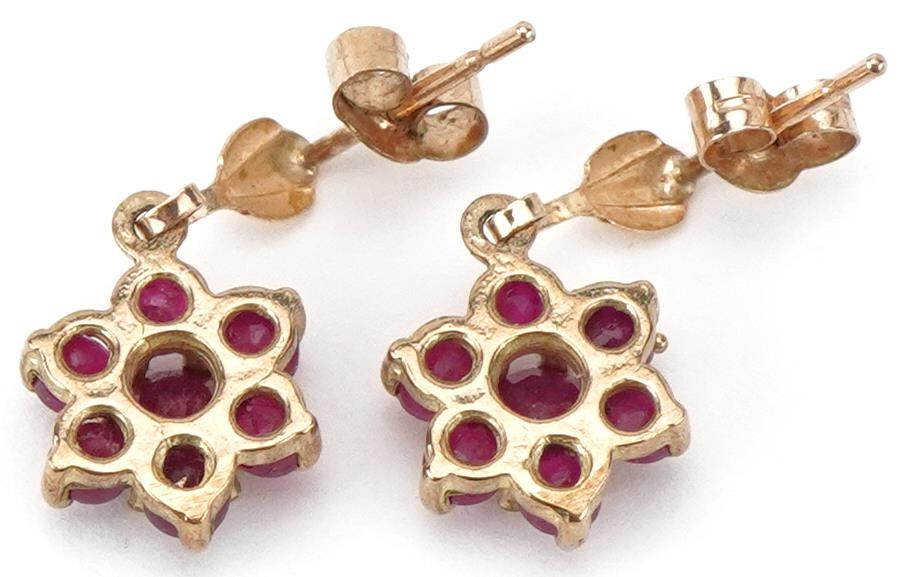 Pair of unmarked gold ruby flower head drop earrings, each 1.7cm high, total 1.4g - Image 2 of 2