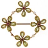 Art Nouveau 15ct gold green tourmaline, ruby and seed pearl flower head brooch, 3.5cm high, 5.7g