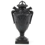 Victorian black painted pottery urn and cover decorated with medallions and swags, WSS and