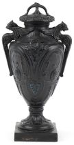 Victorian black painted pottery urn and cover decorated with medallions and swags, WSS and